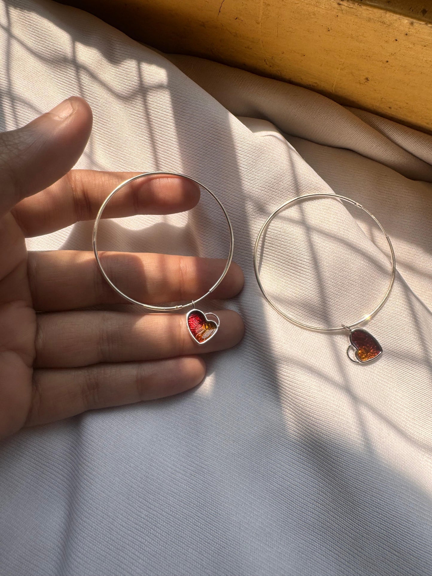 Hanging heart hoop earring
