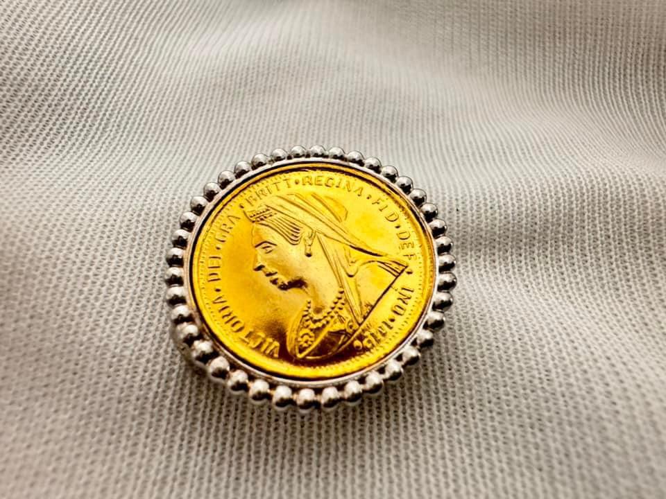 Guinea brooch