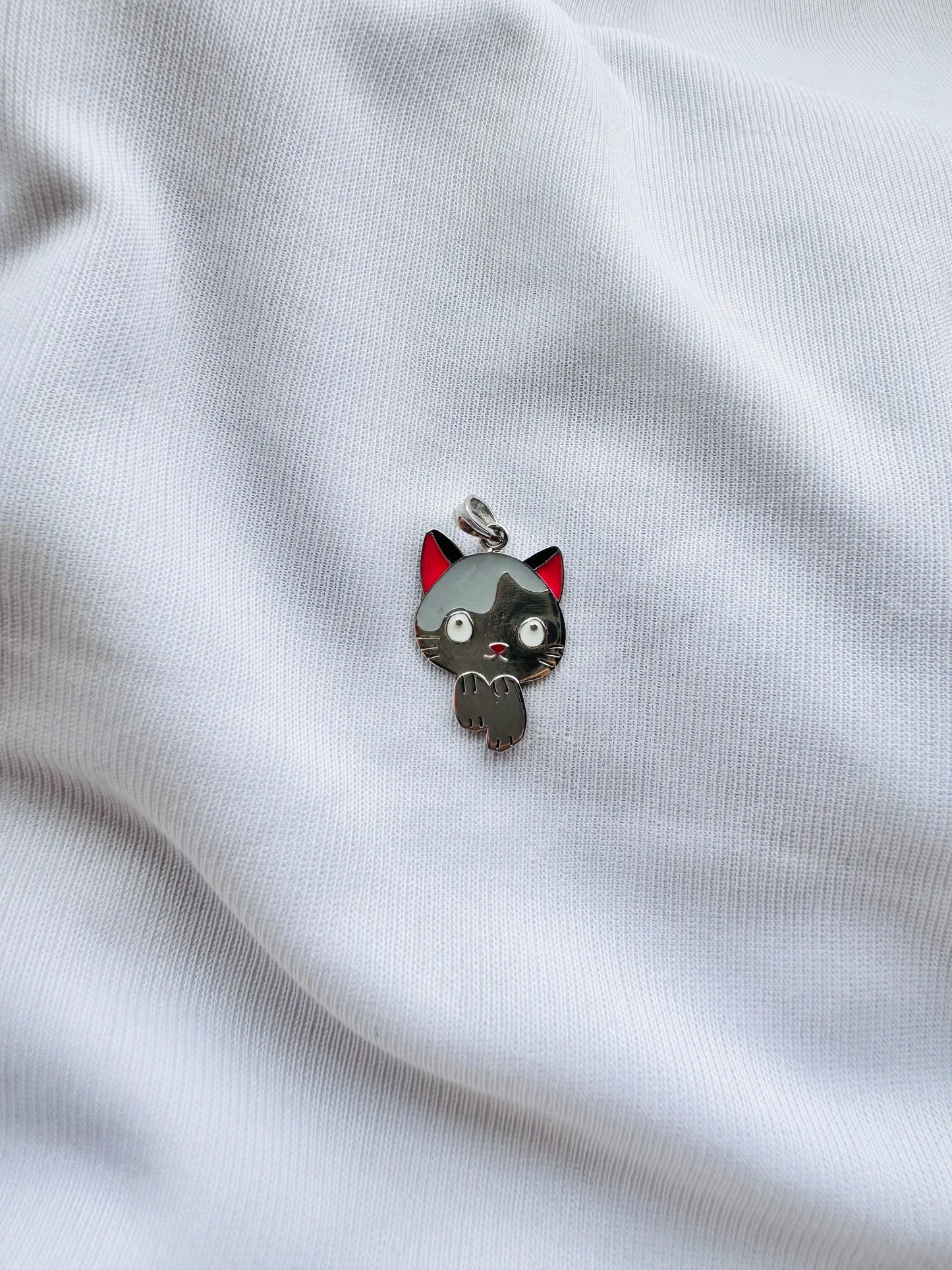 Mischievous kitty pendant