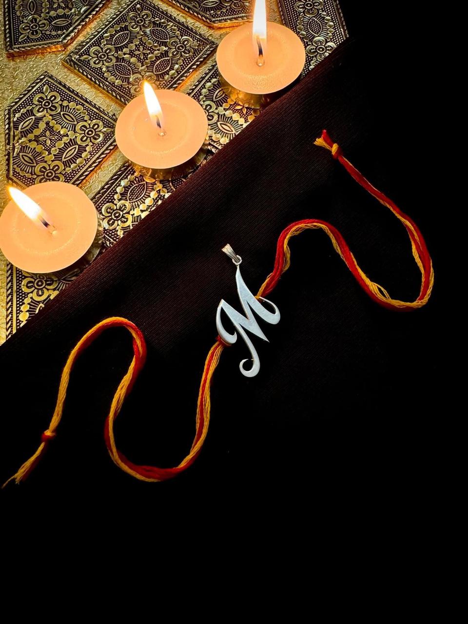 "M" letter rakhi cum pendant