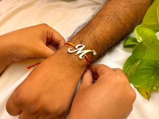"M" letter rakhi cum pendant
