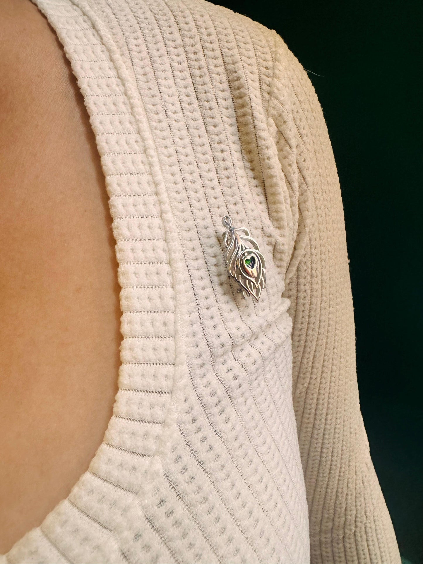 Peacock feather brooch