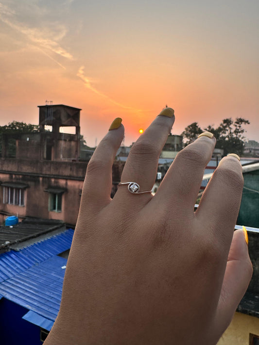Open-eye sparkling zircon ring