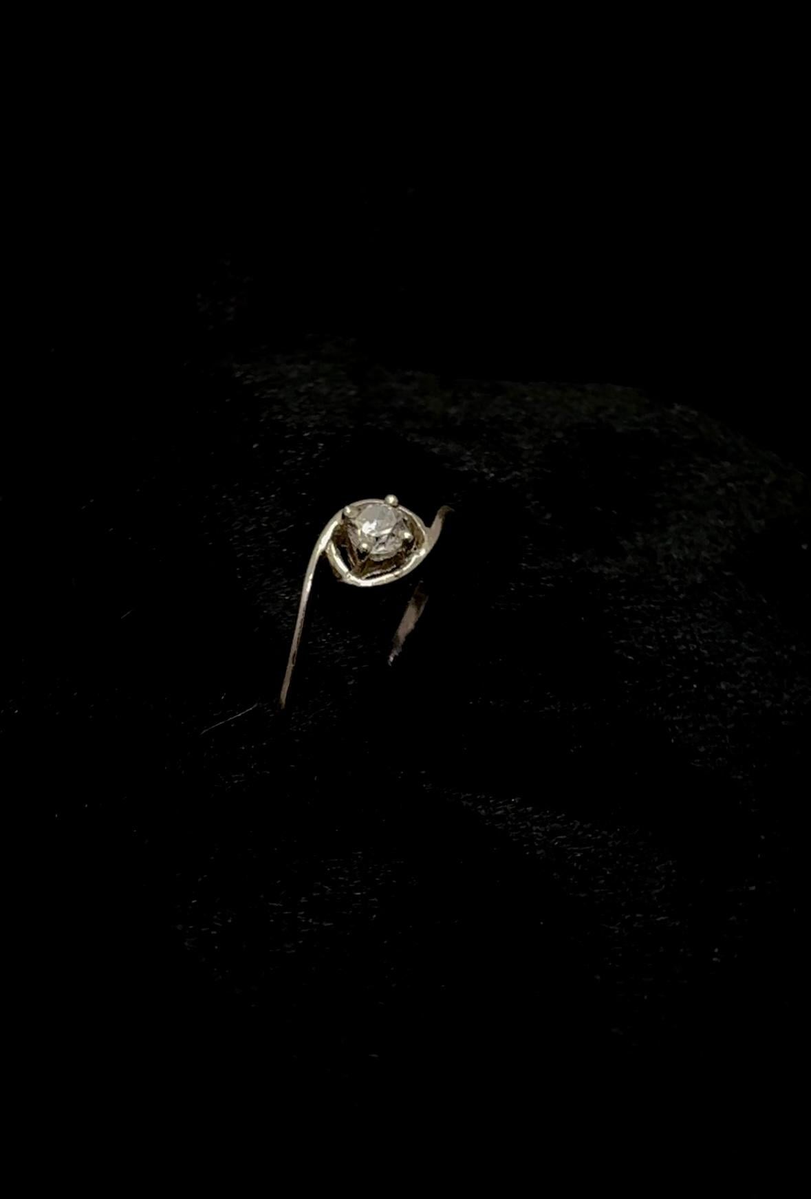 Open-eye sparkling zircon ring