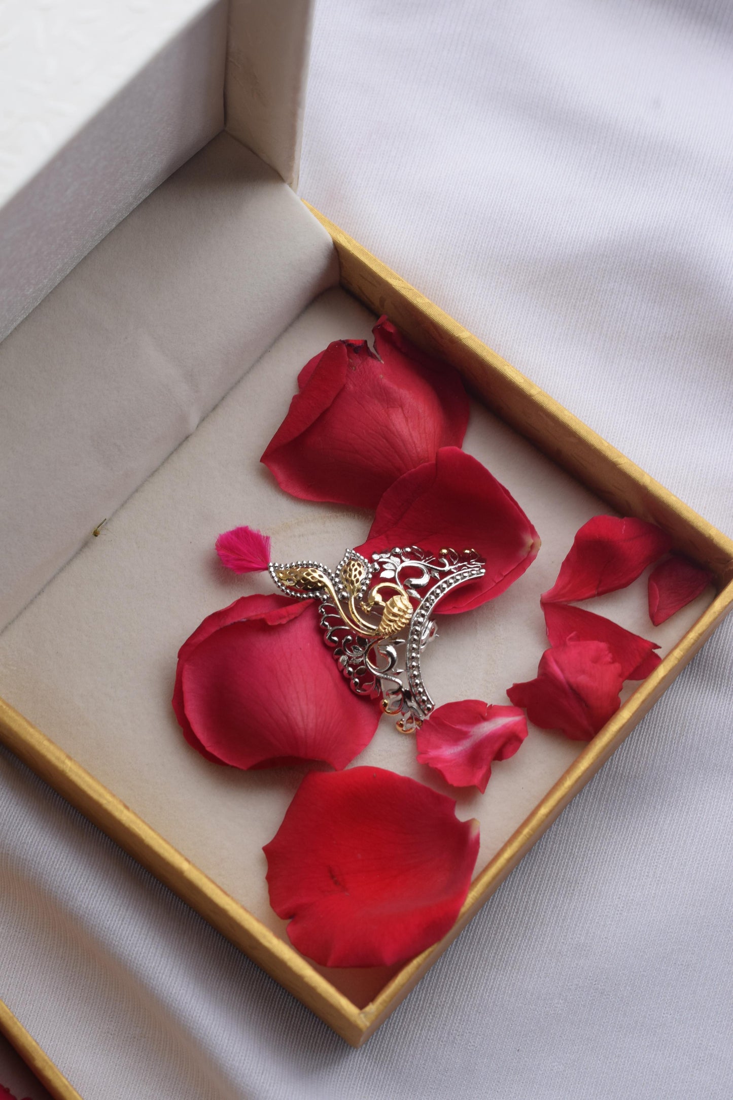 Mukut brooch